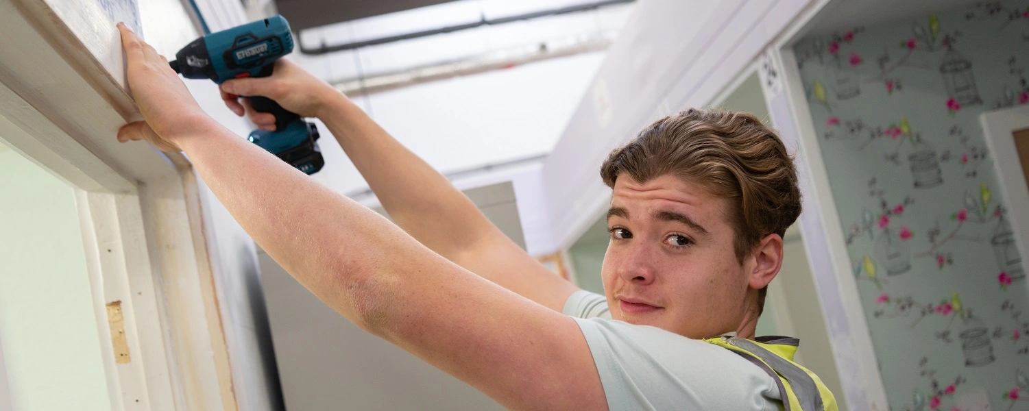 Student uses power tools in the workshop